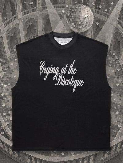 The black Crying@Disco tank top in an empty ballroom of grey paper, under a mirror ball made of paper.
