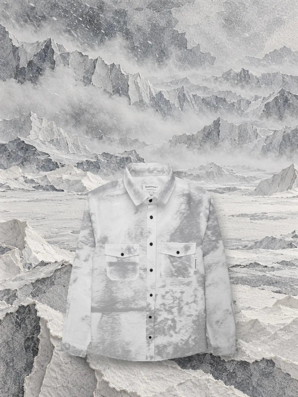 The grey Grey Noise long-sleeve shirt on a glacier of grey and white tissue paper, in the blizzard.