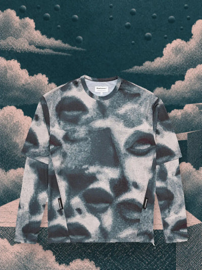 The teal and pink Militant Maw long sleeve t-shirt among pink and teal paper clouds, on steps suspended in the void.