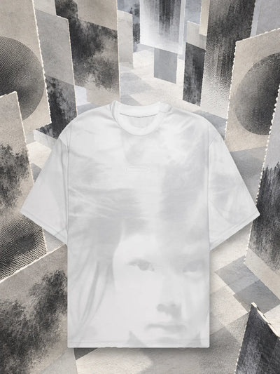 The white Stream t-shirt among hanging panels of grey paper, printed in halftone.