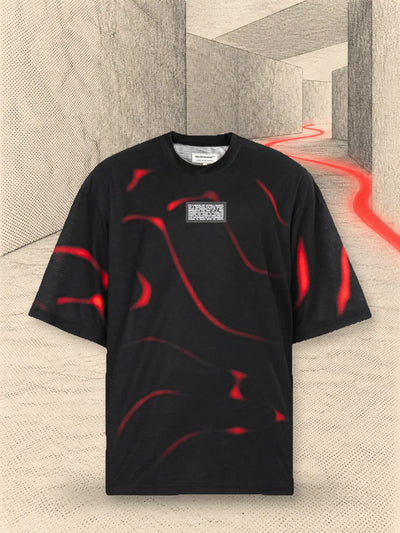 The black Tide t-shirt in a corridor of pale paper, with a thread of red paper running through the air.