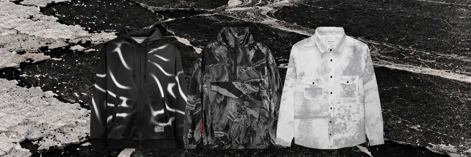 La felpa Tidegrey, l'anorak Insectide Vision e la camicia Grey Noise in fila sul ghiaccio nero di un lago di notte.